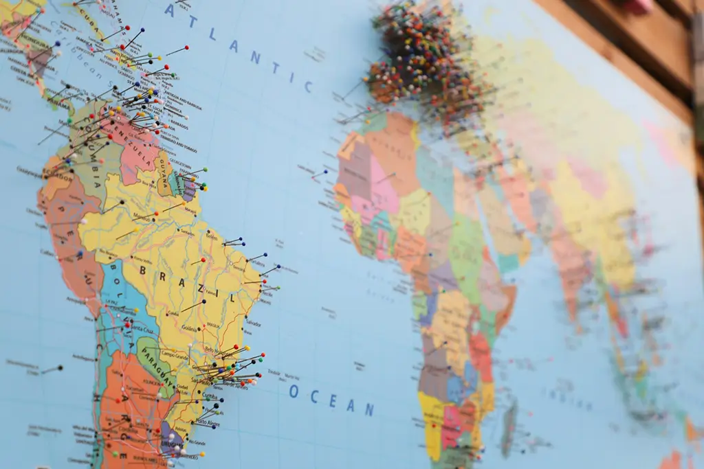 World map with pins marking the target markets for a content localization project across multiple regions.