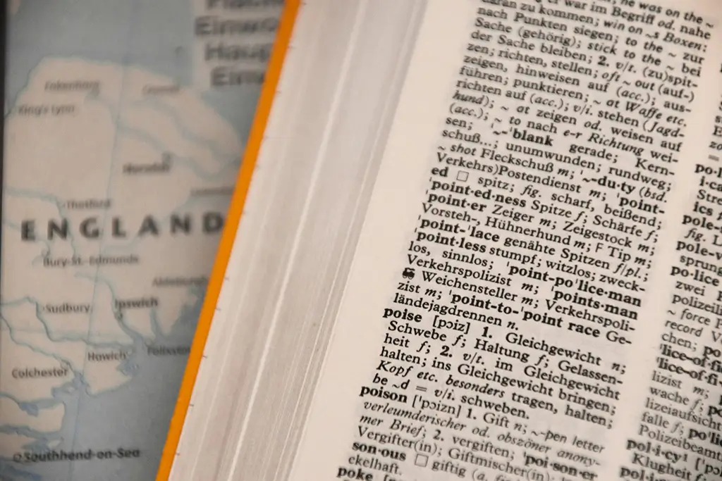 A German-English dictionary on a map of England, illustrating how language pairs shape the cost of translation.