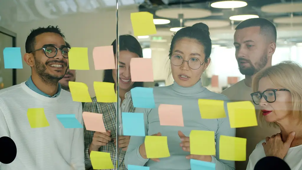 A creative team reworking campaign copy with transcreation.